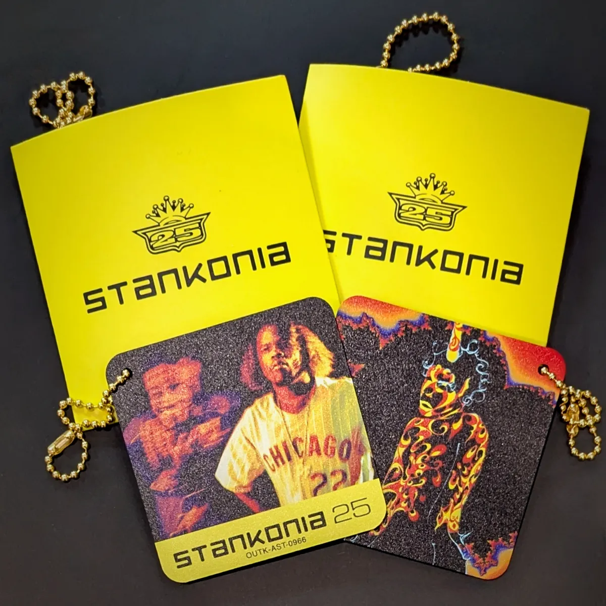 Two Outkast Stankonia 25 Custom Goodz: a yellow card with the Stankonia text logo and a smaller card with the album cover artwork.